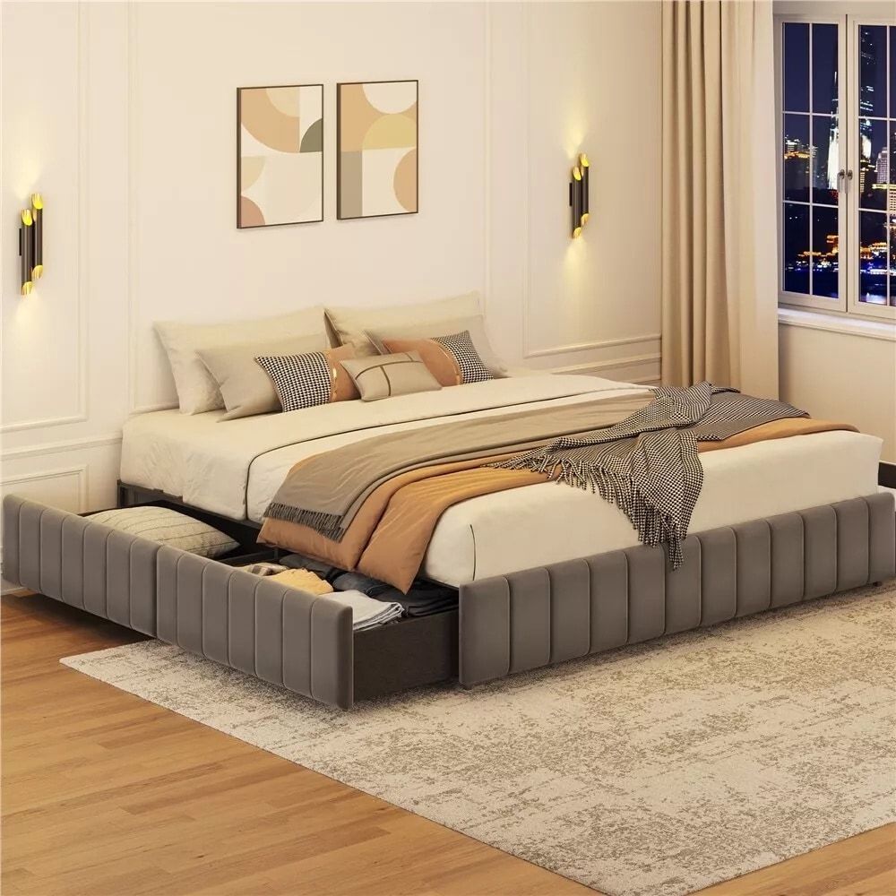 A bedroom with a bed and two drawers underneath it.