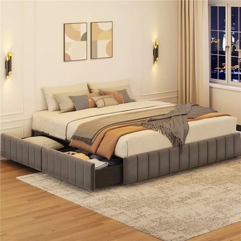 A bedroom with a bed and two drawers underneath it.