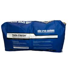 A blue bag of thin finish is sitting on a white surface.
