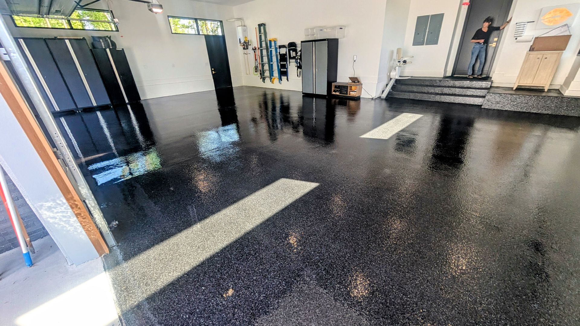 Sunlit garage with polished epoxy flake flooring installed by Zachary Daniel Concrete in Ware Shoals, SC.