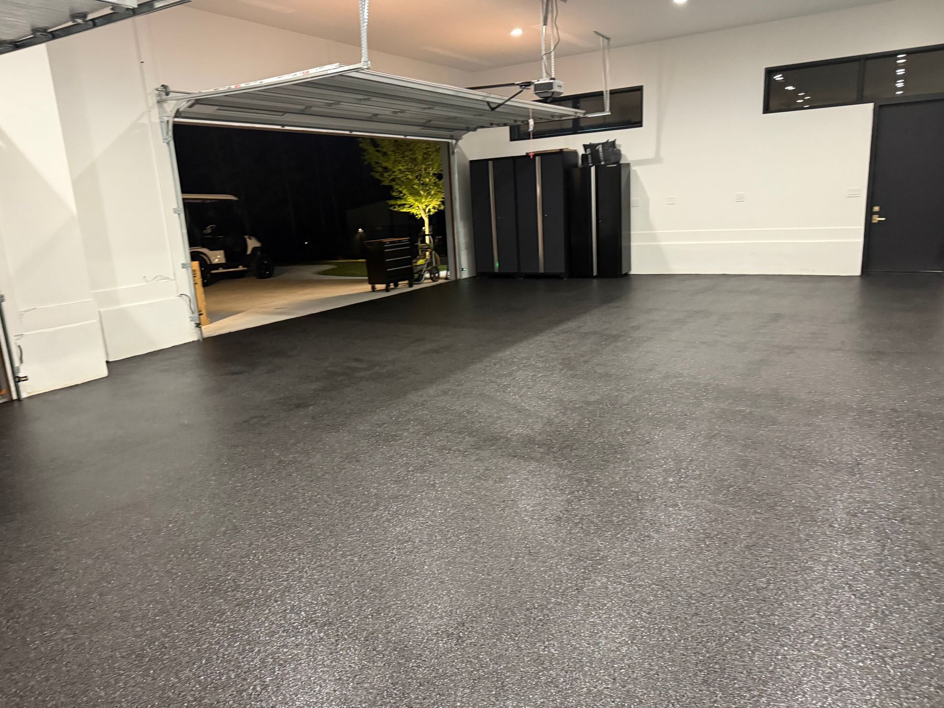 Matte epoxy flake garage floor completed at night installed by Zachary Daniel Concrete in Princeton, SC.
