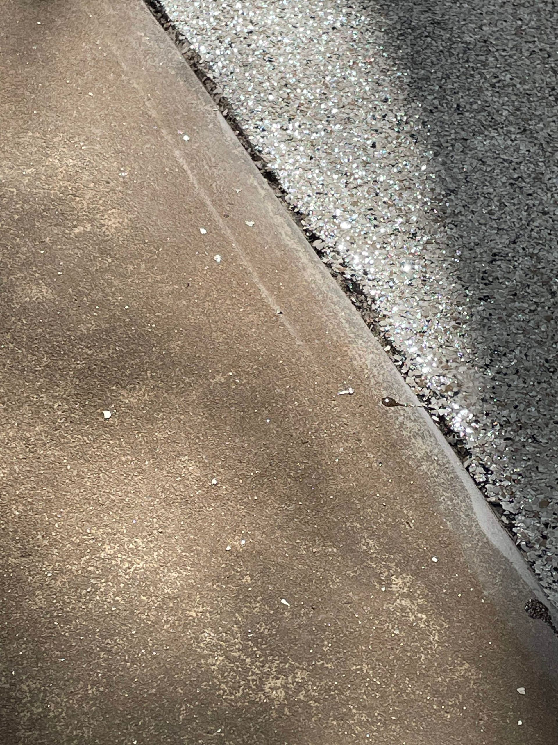 Epoxy-coated surface with clean edge detailing installed by Zachary Daniel Concrete in Ellenboro, NC.