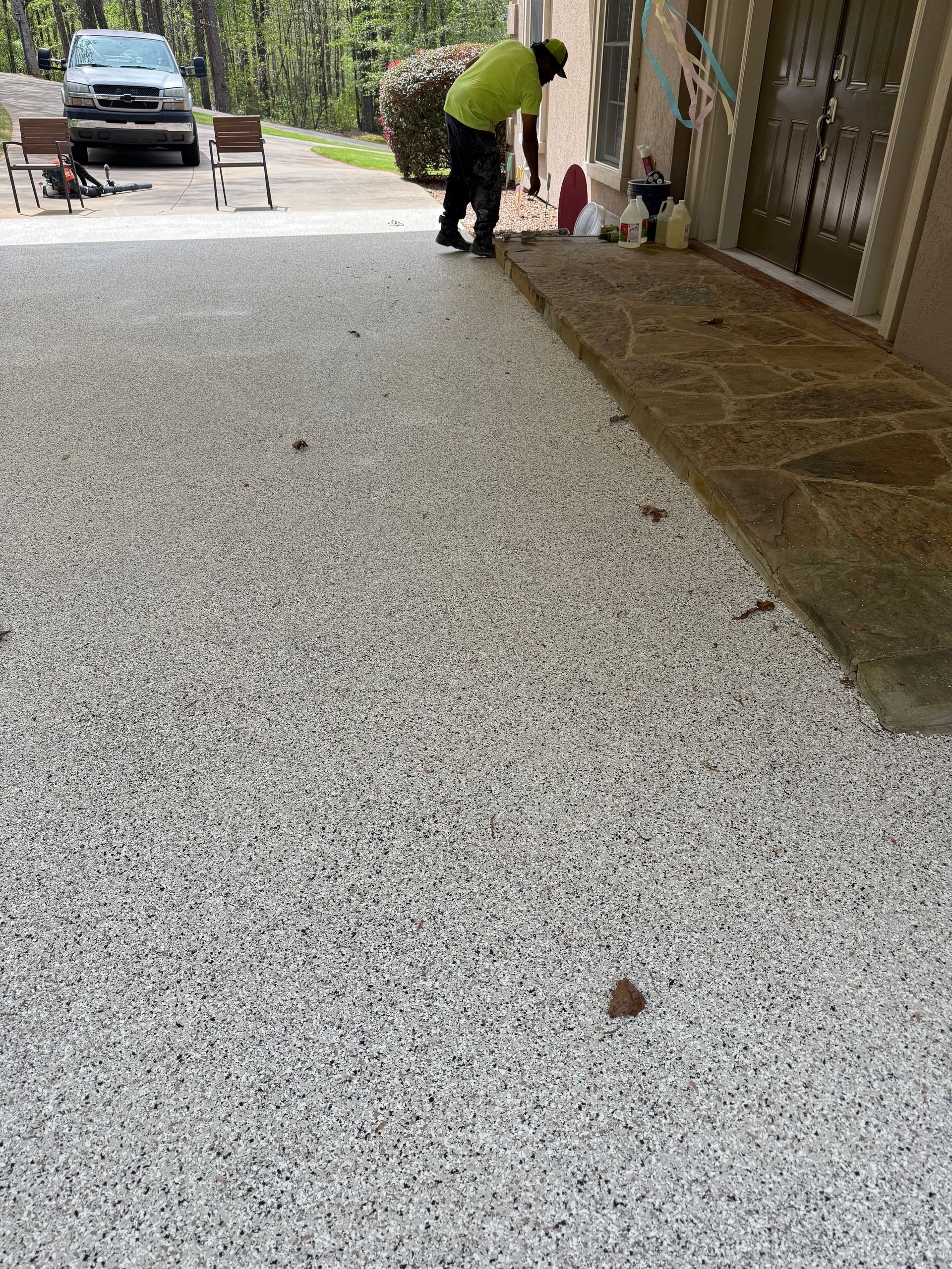 White and black epoxy flake flooring on porch installed by Zachary Daniel Concrete in Lake Lure, NC.