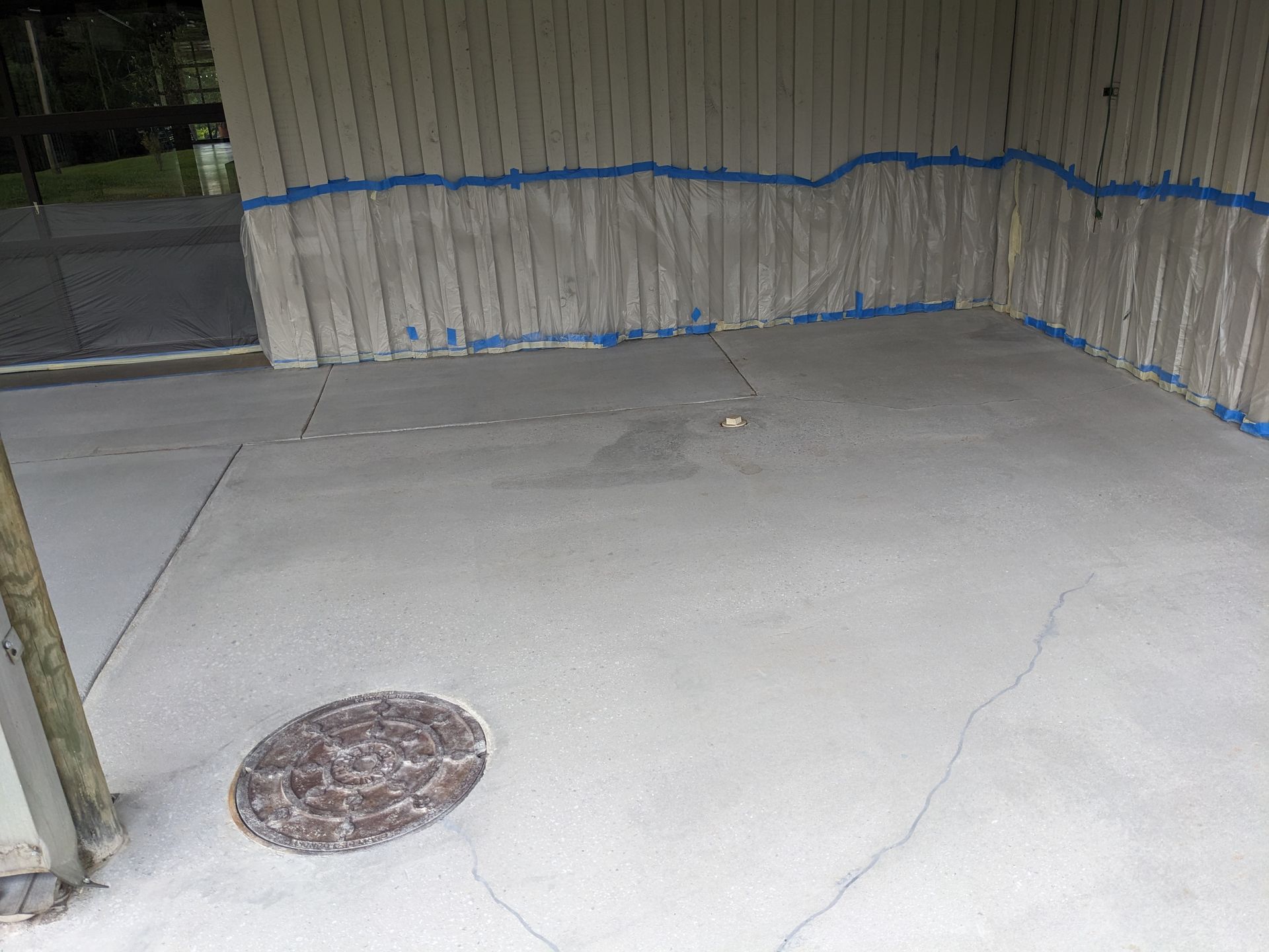 There is a manhole cover in the middle of the room.