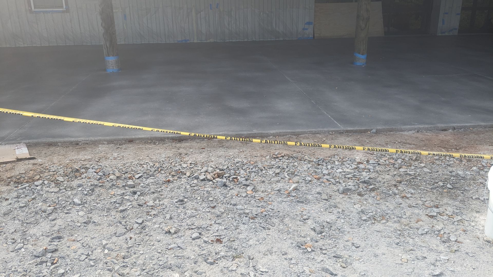 a concrete driveway is being built in front of a building .