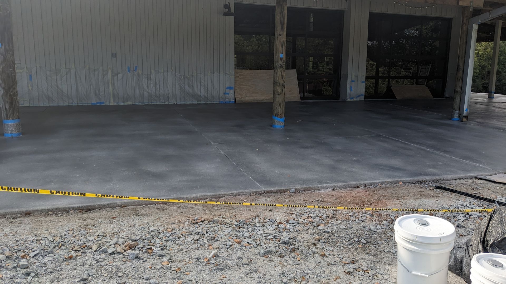a concrete driveway is being built in front of a building .