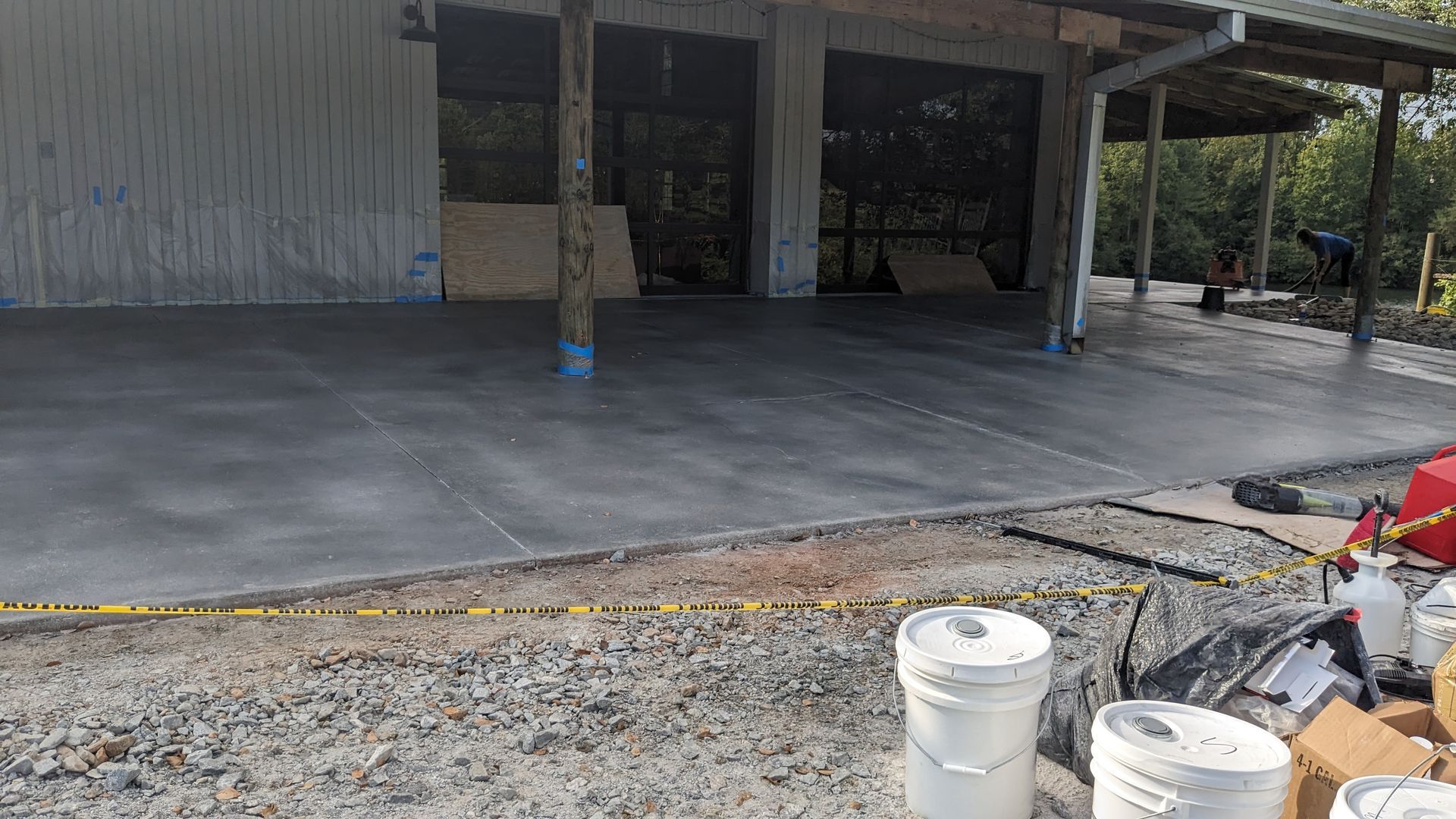 a concrete driveway is being built in front of a building .