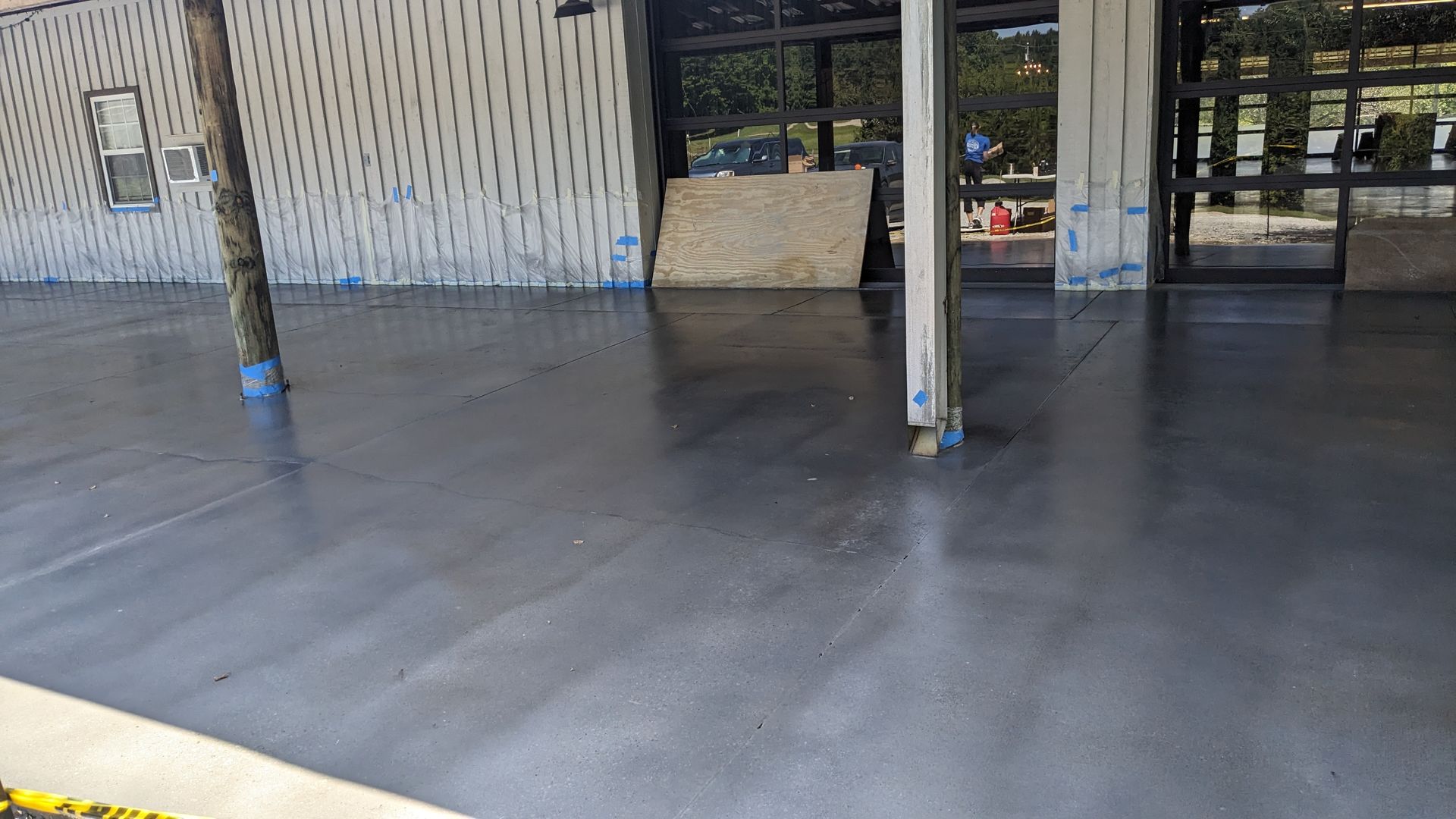 a concrete floor is being installed in a building under construction .