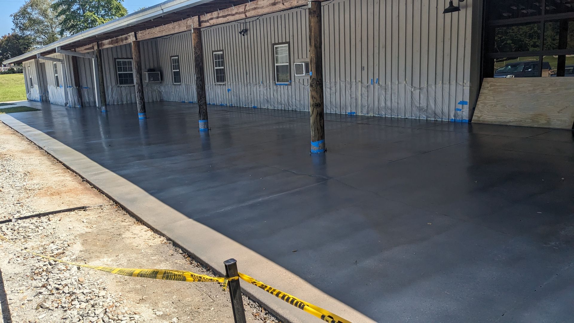 a concrete patio is being built in front of a building .