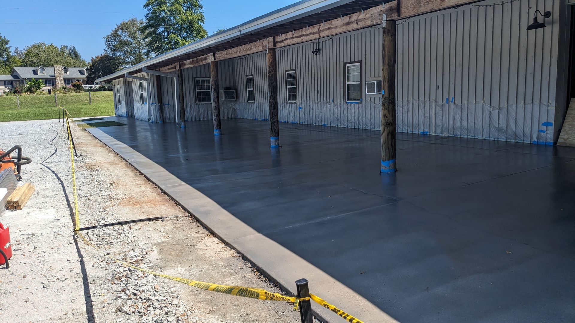 a concrete driveway is being built in front of a building .