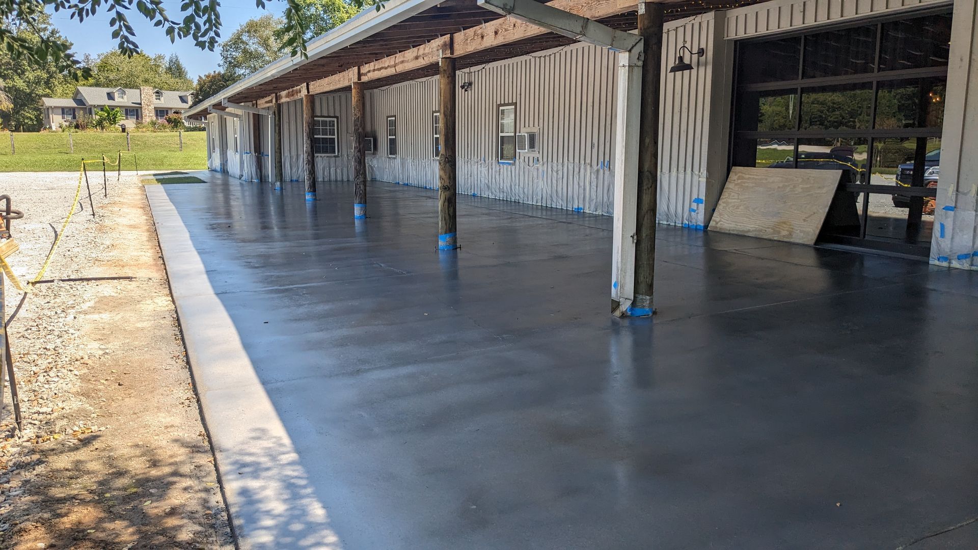 a concrete patio is being built in front of a building .