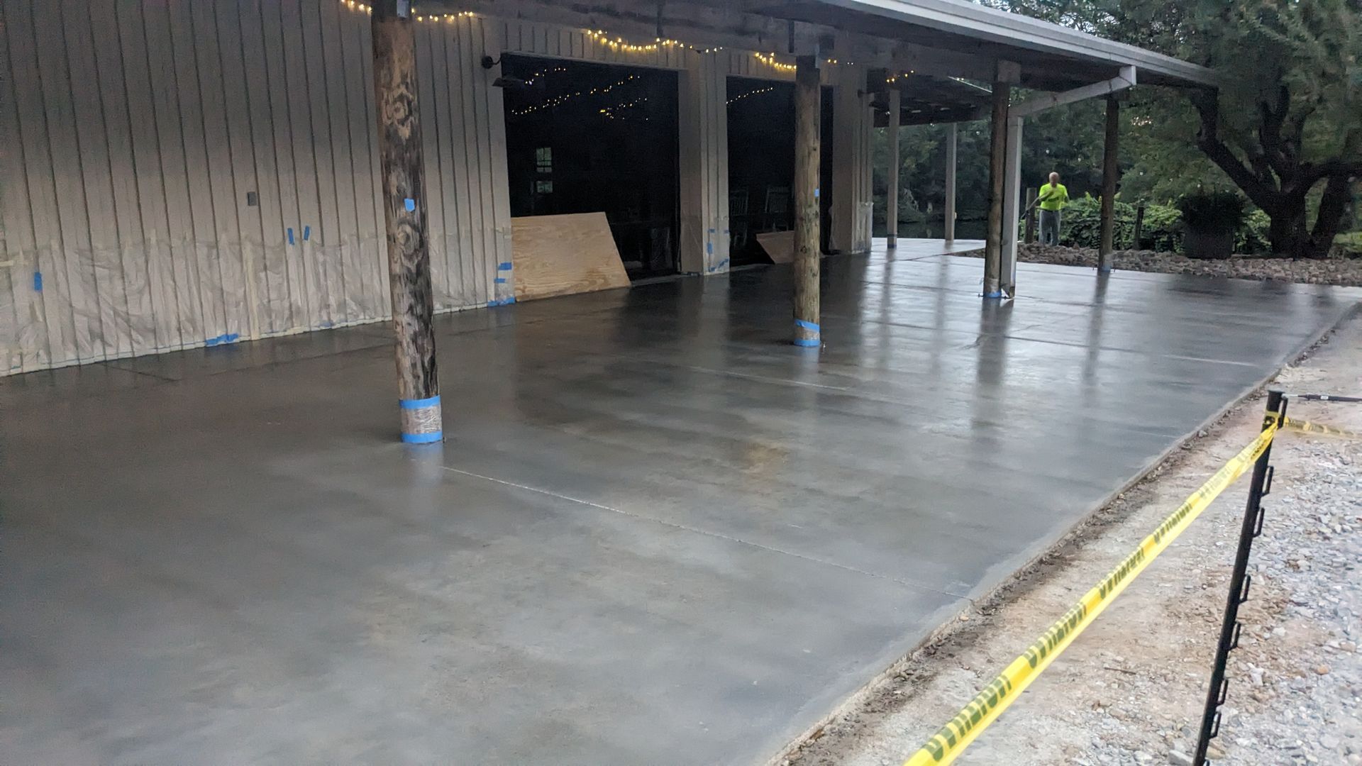 a concrete patio is being built in front of a building .
