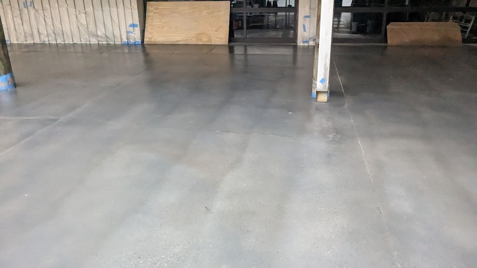 a concrete floor is being installed in a building .