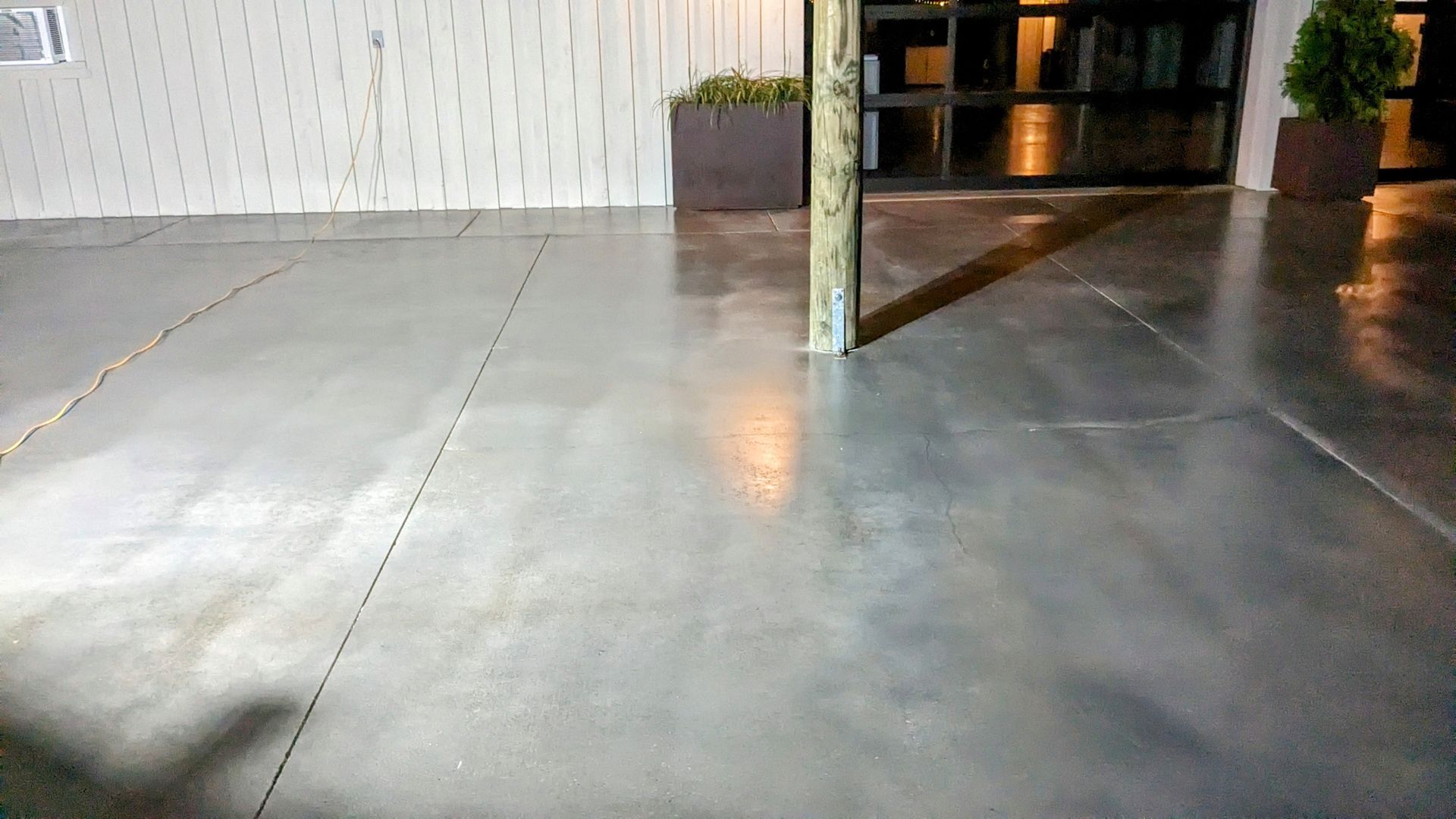 a close up of a concrete floor in front of a building .