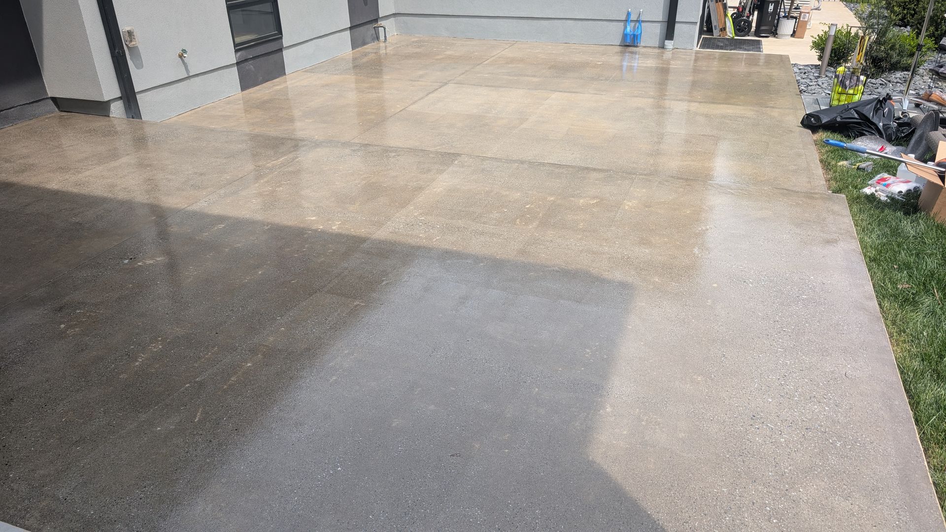 Driveway grind and seal finish reflecting sunlight installed by Zachary Daniel Concrete in Golden Grove, SC.