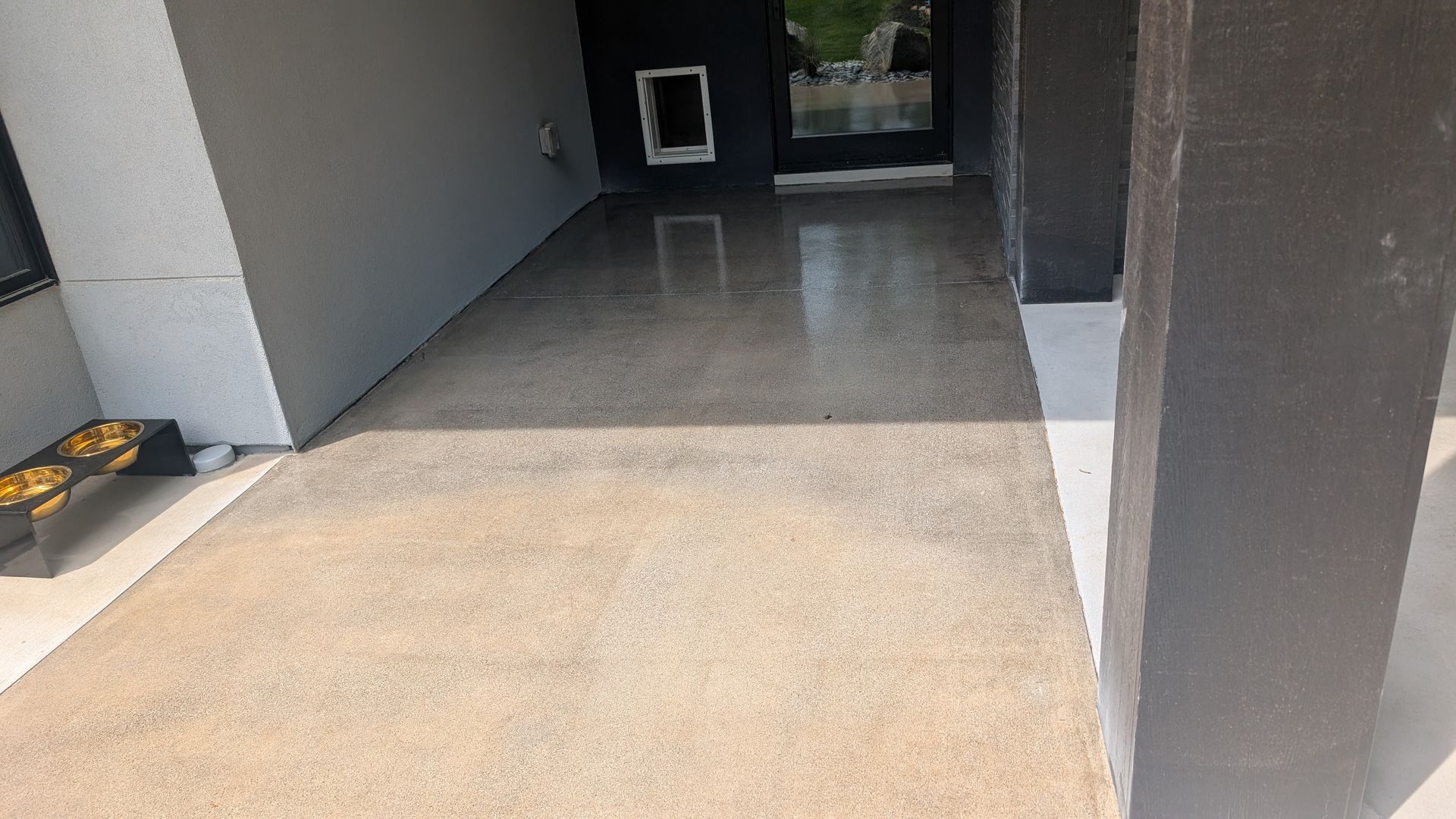 Covered entryway with grind and seal concrete finish installed by Zachary Daniel Concrete in Parker, SC.