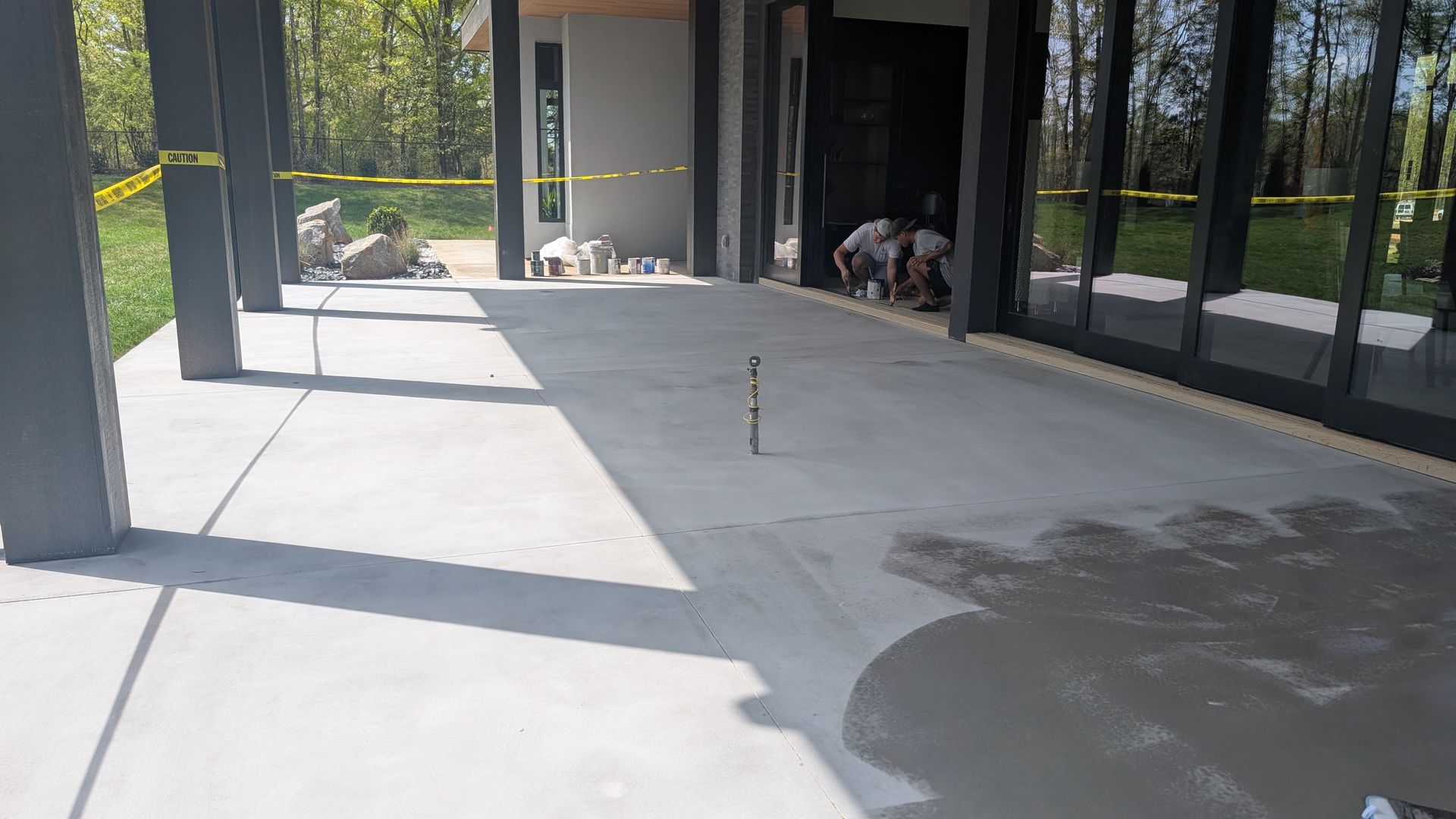 Sunlit porch with sealed concrete surface installed by Zachary Daniel Concrete in Travelers Rest, SC.