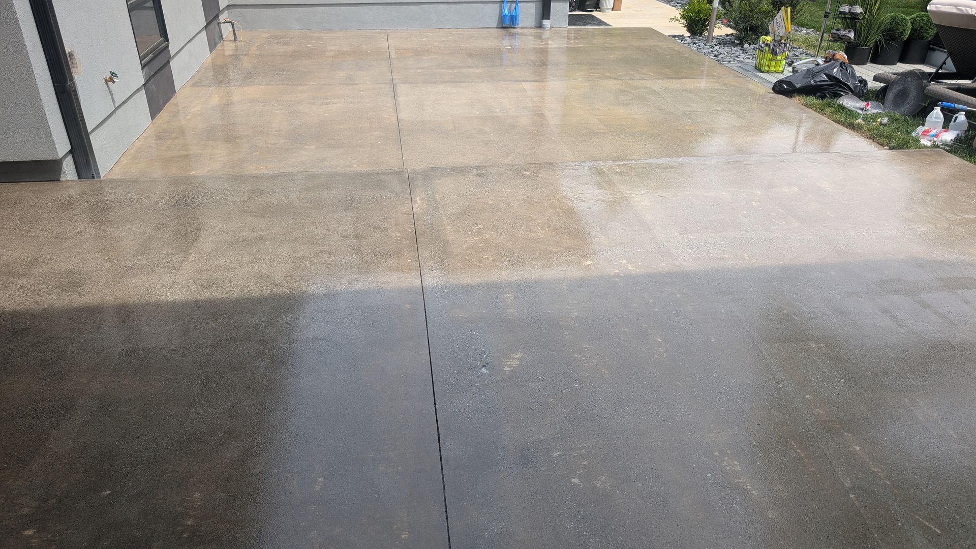 Front patio with reflective sealed concrete installed by Zachary Daniel Concrete in Wade Hampton, SC.