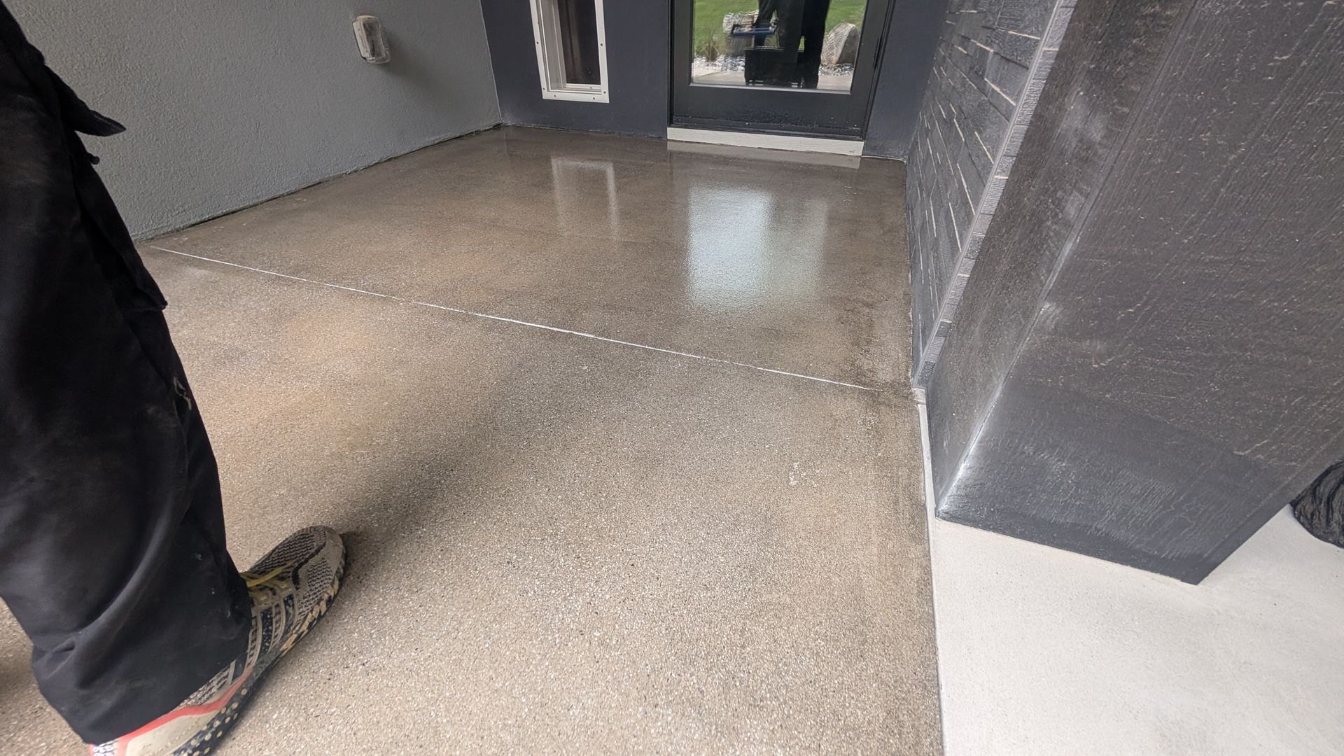 Sealed concrete surface under shaded pillars installed by Zachary Daniel Concrete in Judson, SC.
