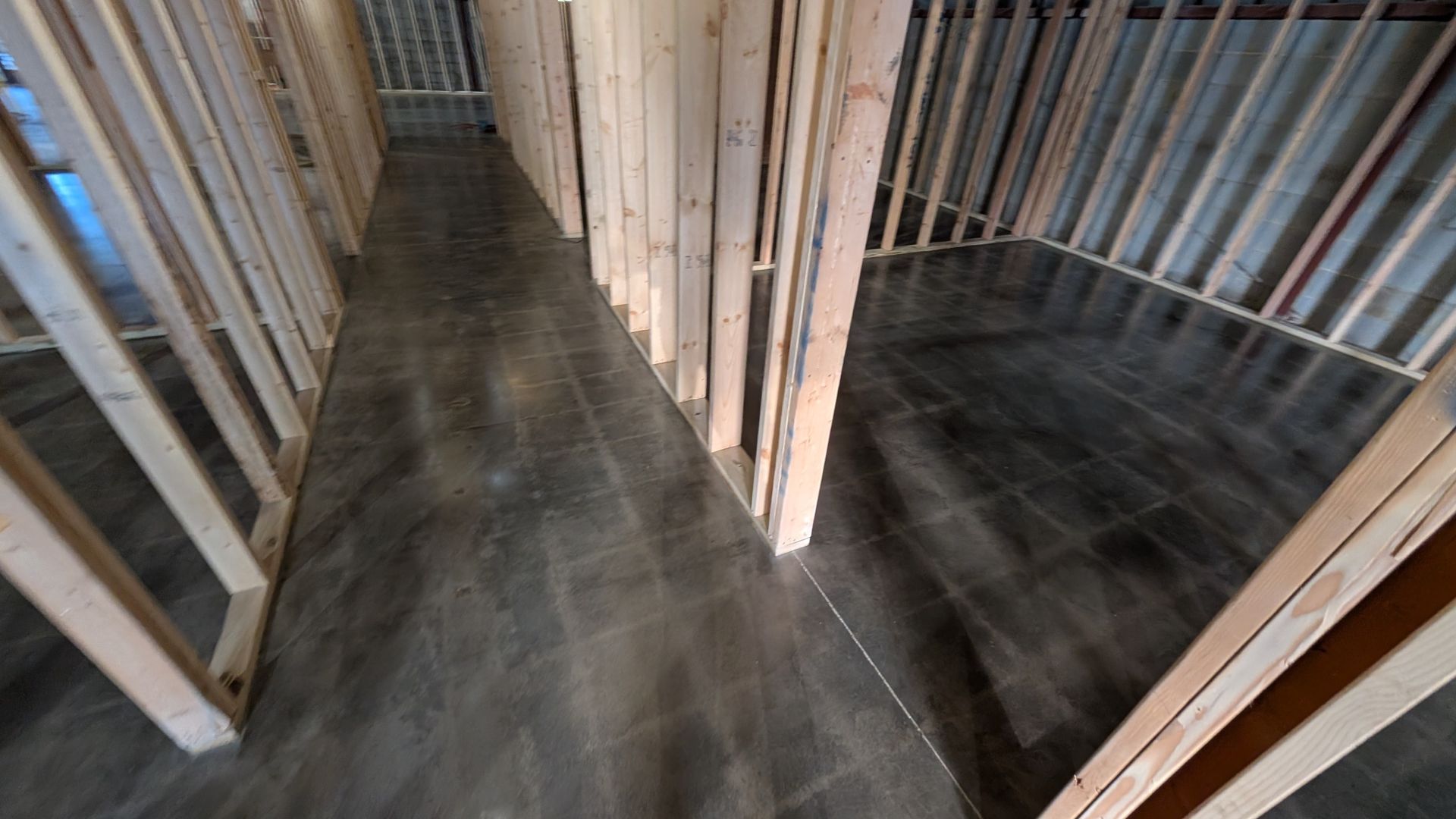 Small room with dark Hone Guard concrete coating installed by Zachary Daniel Concrete in Clifton, SC.