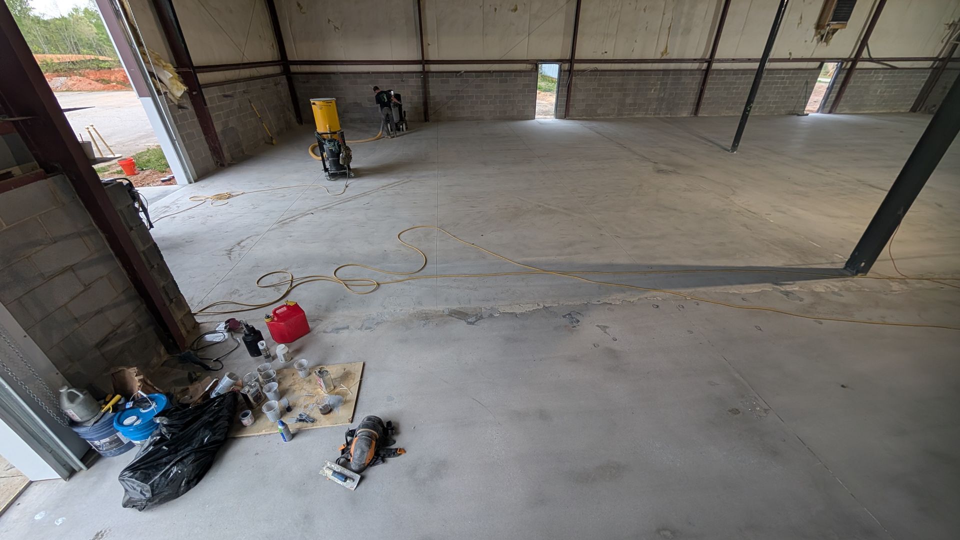 Interior warehouse concrete prep with visible tool lines installed by Zachary Daniel Concrete in Glendale, SC.