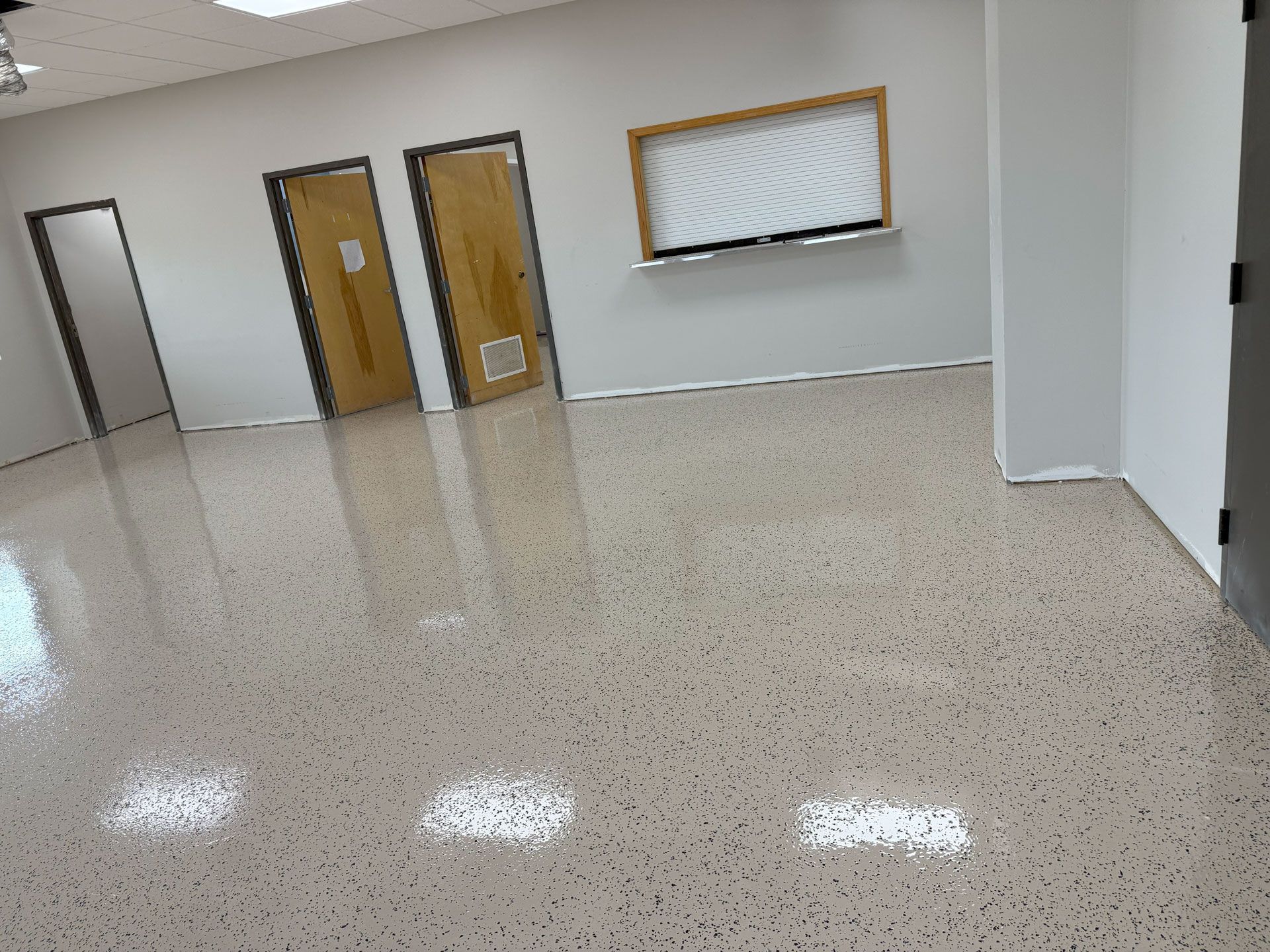 Zachary Daniel Concrete installed black metallic epoxy flooring for a garage in Concord, North Carolina.