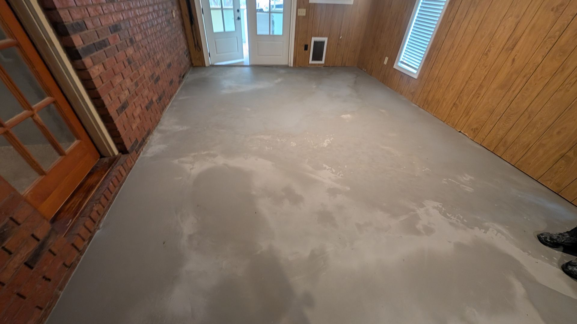 Self-leveling overlay applied on smooth subfloor installed by Zachary Daniel Concrete in Easley, SC.