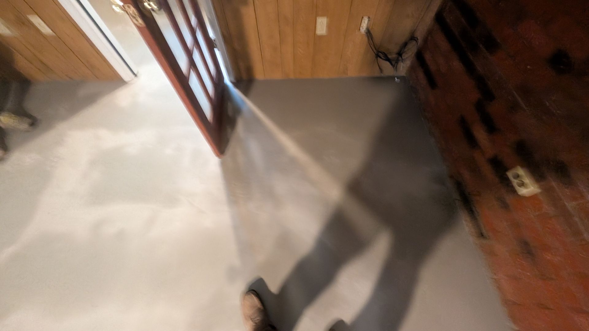 Mid-stage overlay drying across wooden flooring base installed by Zachary Daniel Concrete in Norris, SC.