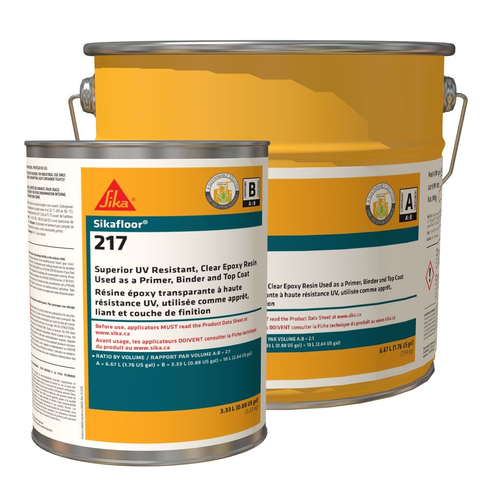 Two cans of sika floor 217 sitting next to each other