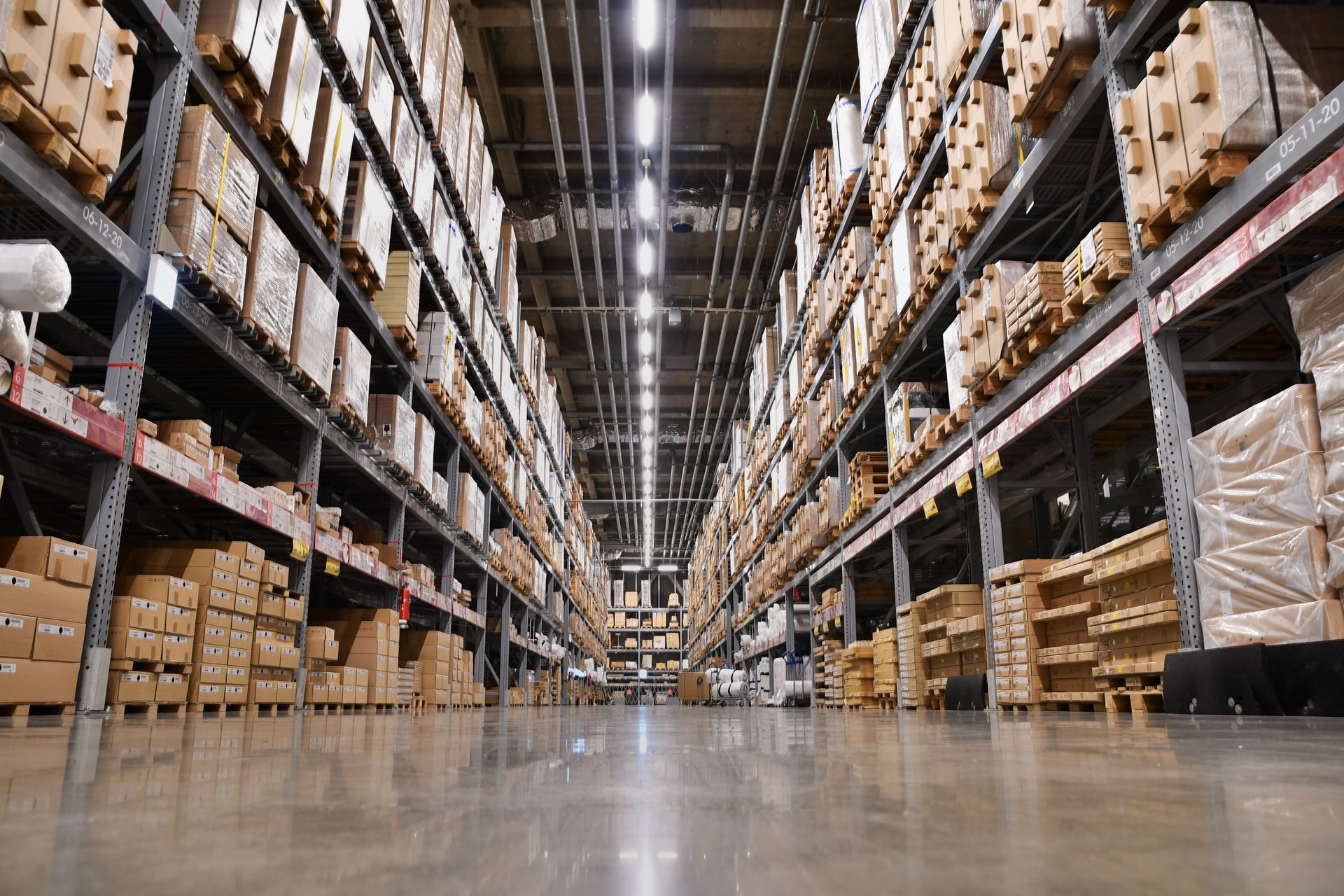 A large warehouse filled with lots of boxes and shelves.