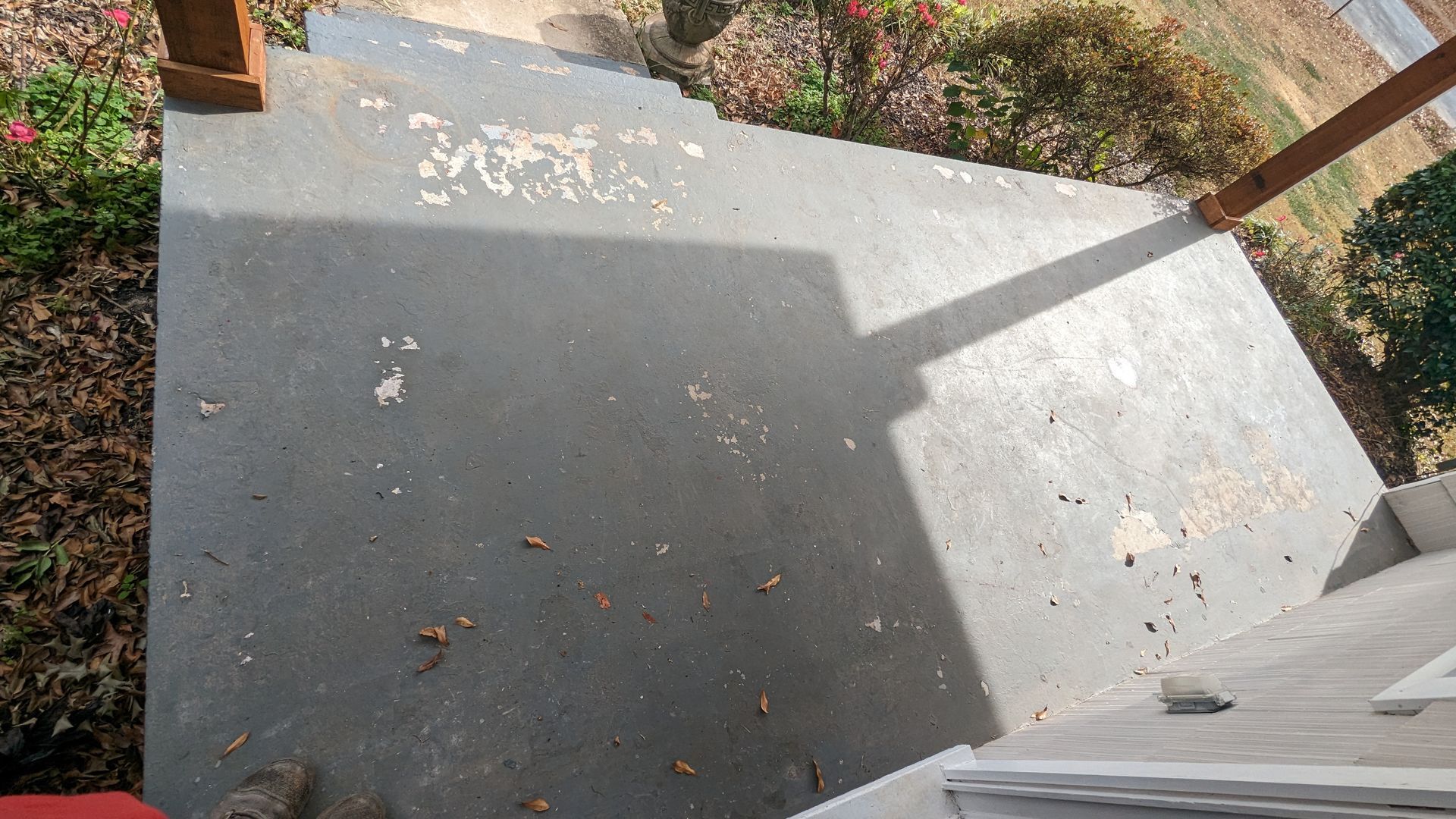 A staircase with a shadow of a person on it