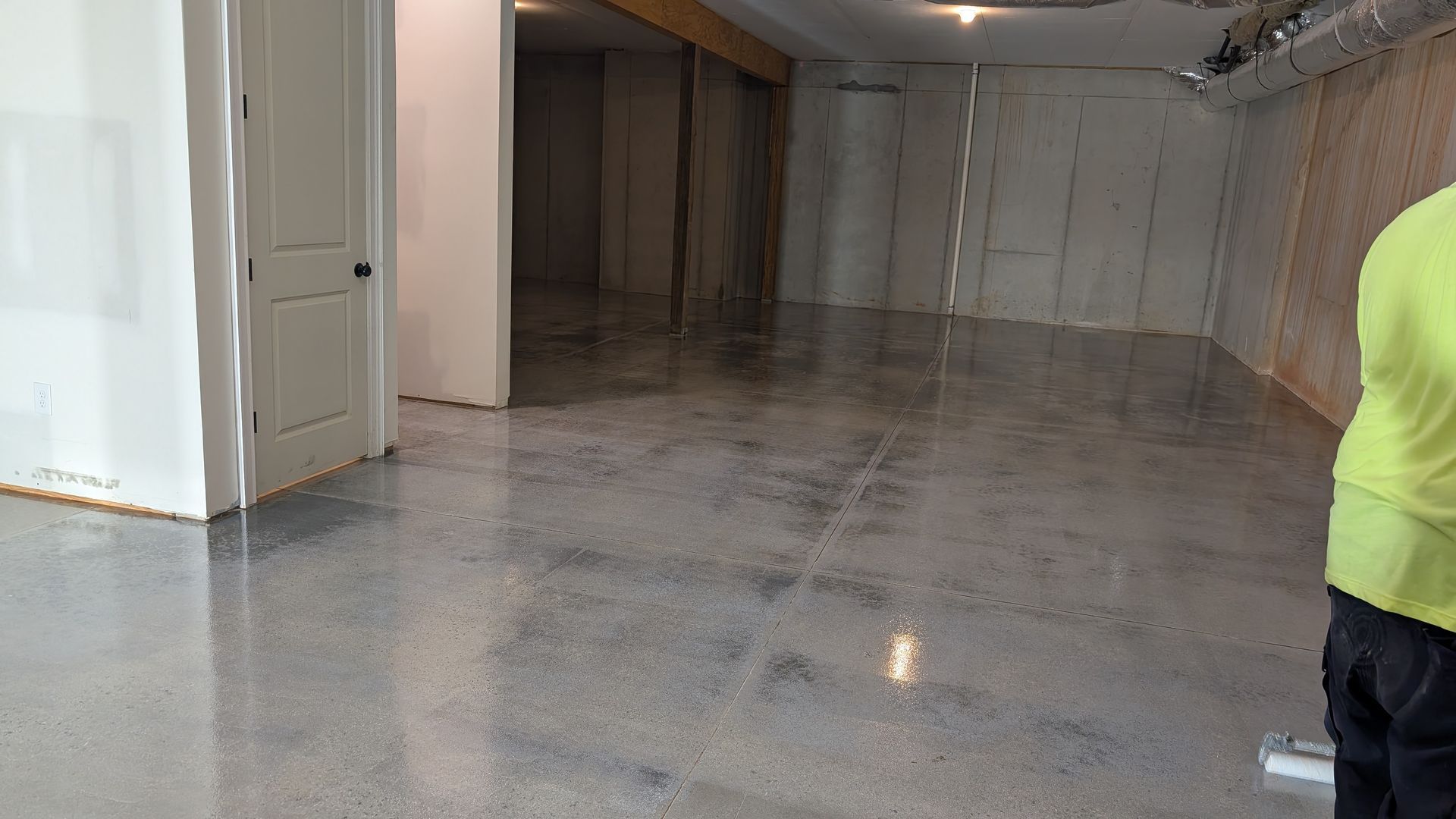Polished basement floor with sealed finish installed by Zachary Daniel Concrete in Williamston, SC.