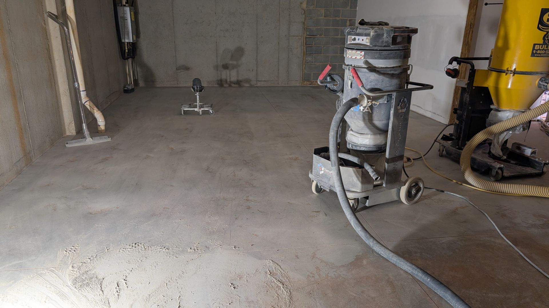 Floor grinder prepping concrete for sealing installed by Zachary Daniel Concrete in Norris, SC.