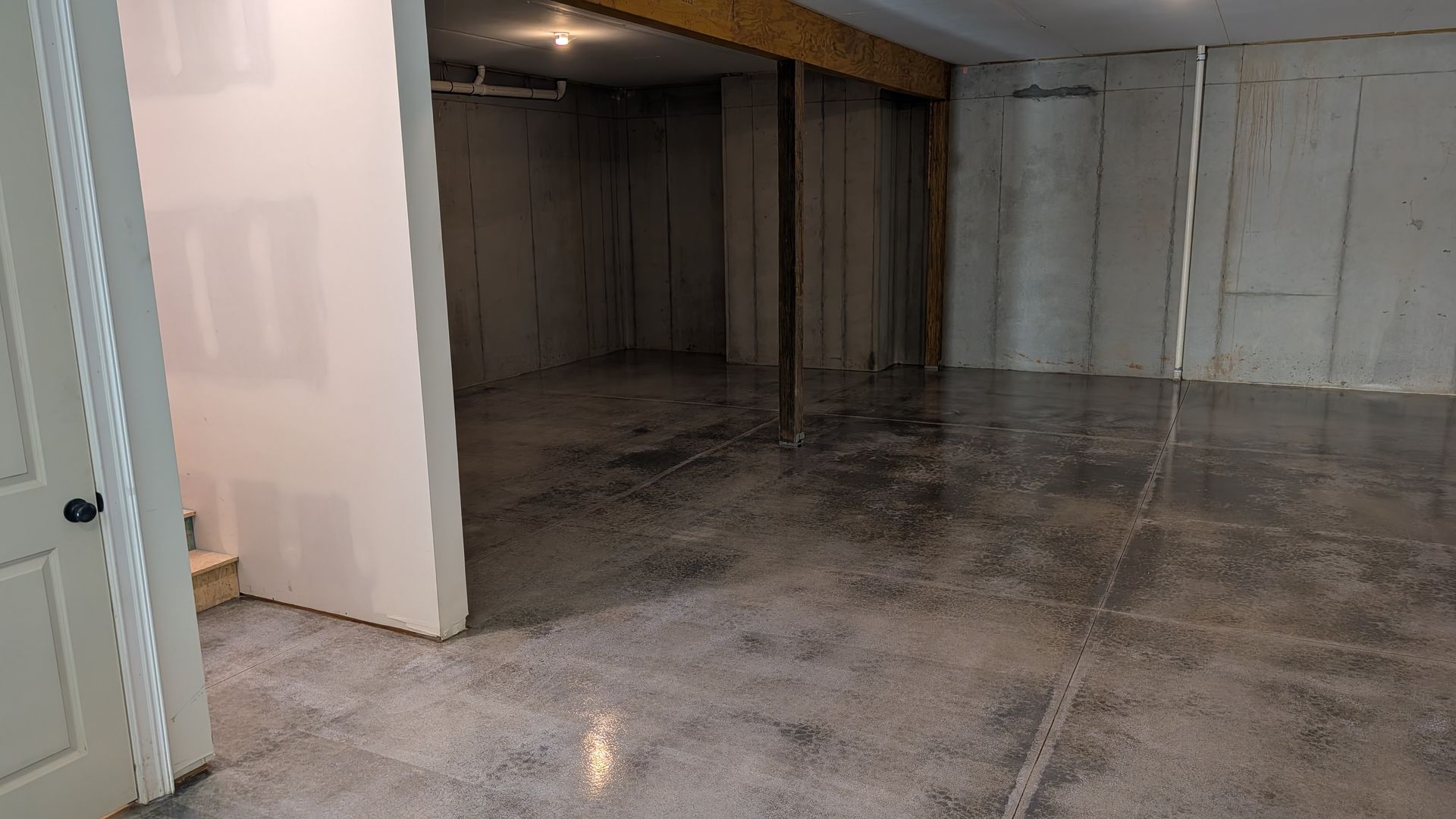 Basement grind and seal flooring with even gloss installed by Zachary Daniel Concrete in Slater-Marietta, SC.