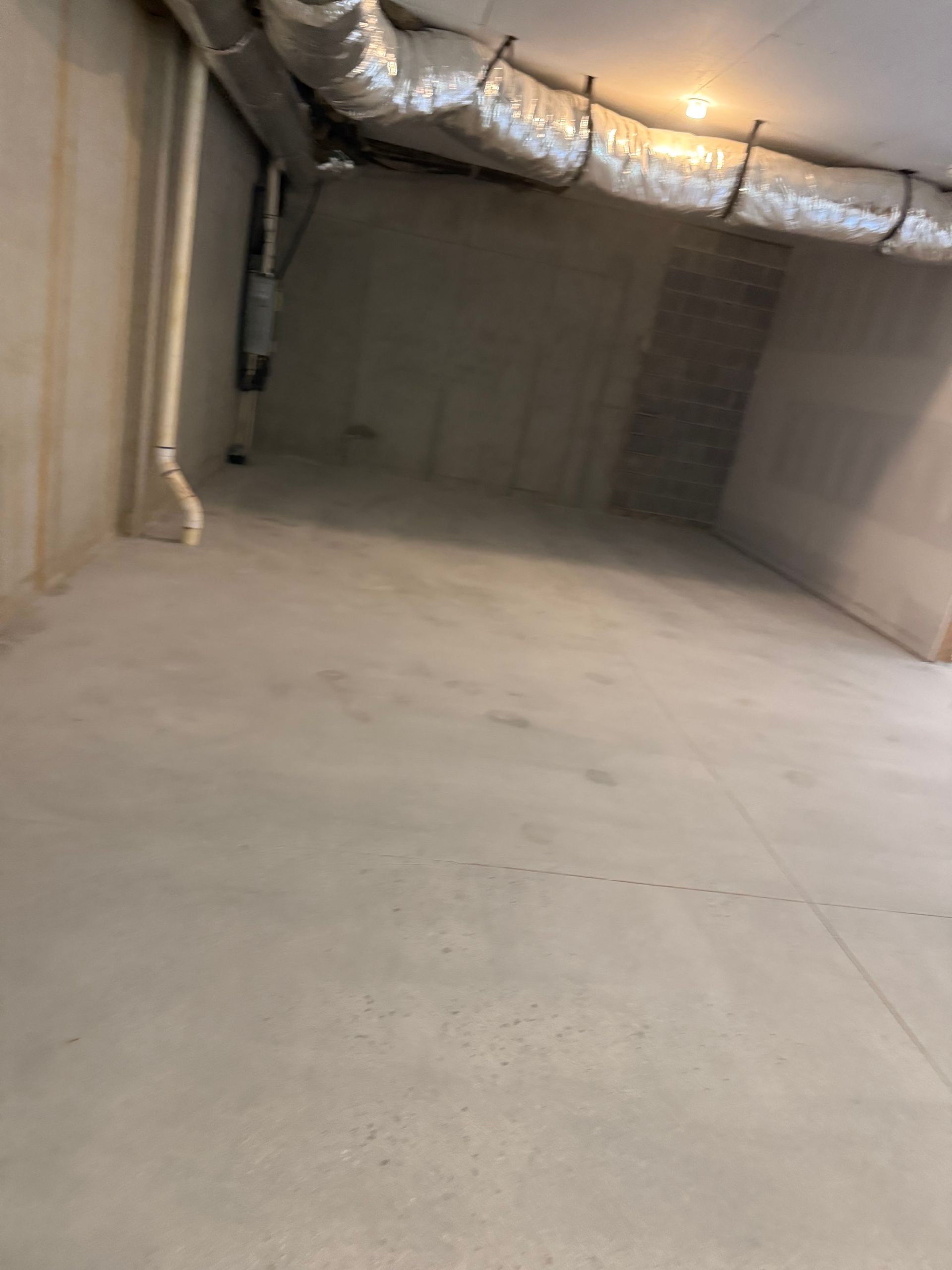 Clean epoxy flake finish along patio edge installed by Zachary Daniel Concrete in Cliffside, NC.