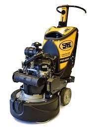 A yellow and black machine is sitting on a white surface.