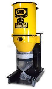 A yellow vacuum cleaner is sitting on a white surface.