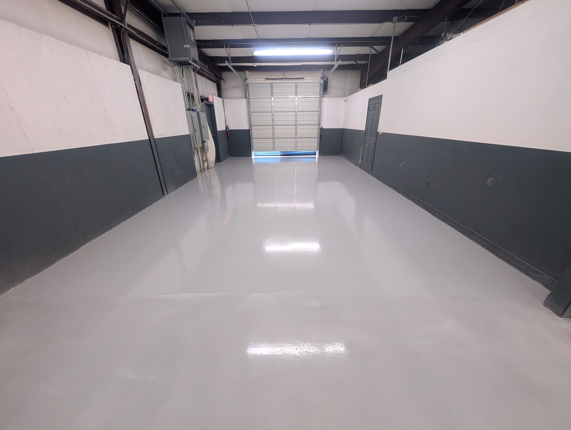 Zachary Daniel Concrete installed black metallic epoxy flooring for a garage in Concord, North Carolina.