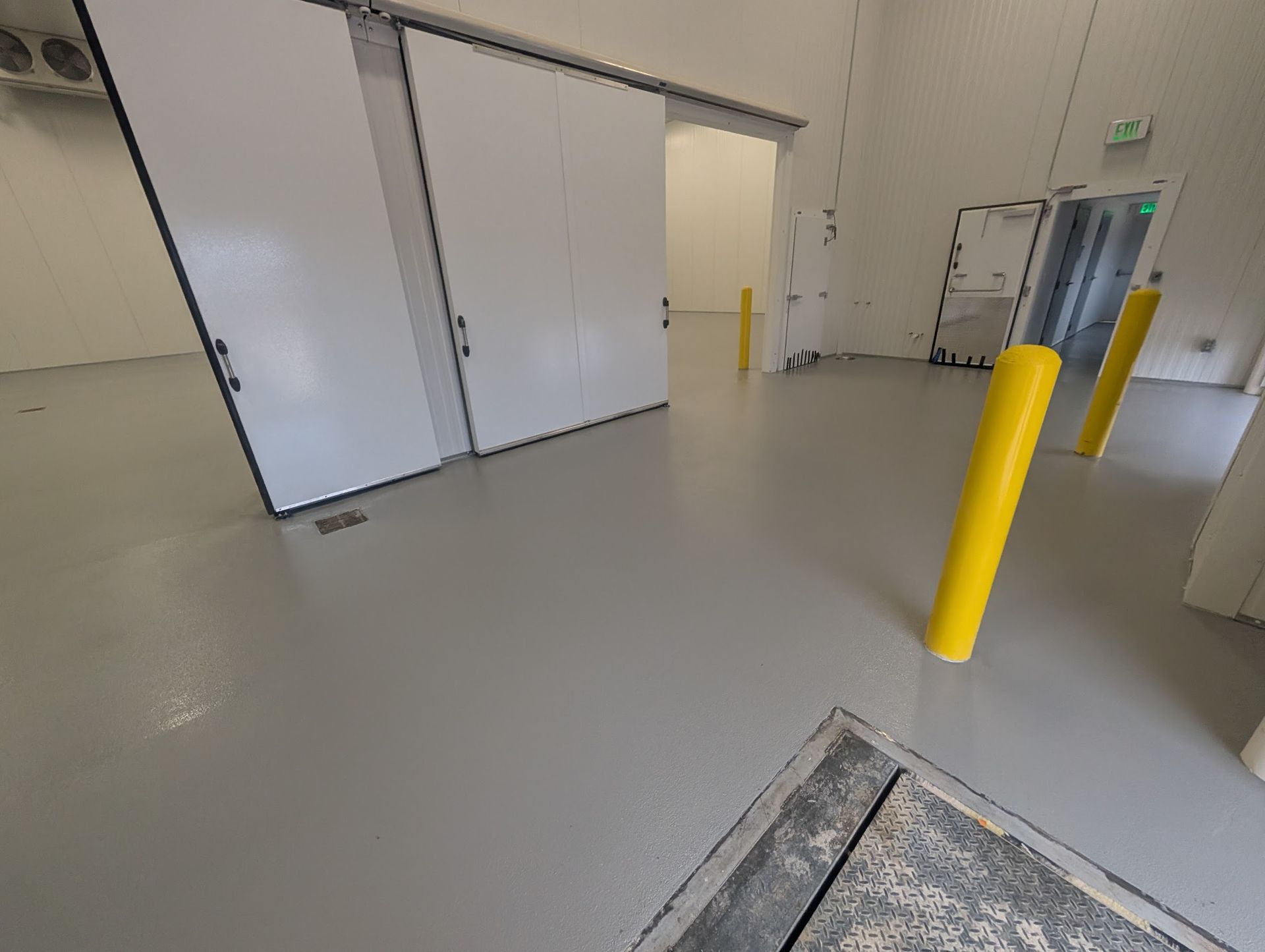 Zachary Daniel Concrete applied light blue epoxy flooring in a warehouse in Rock Hill, South Carolina.