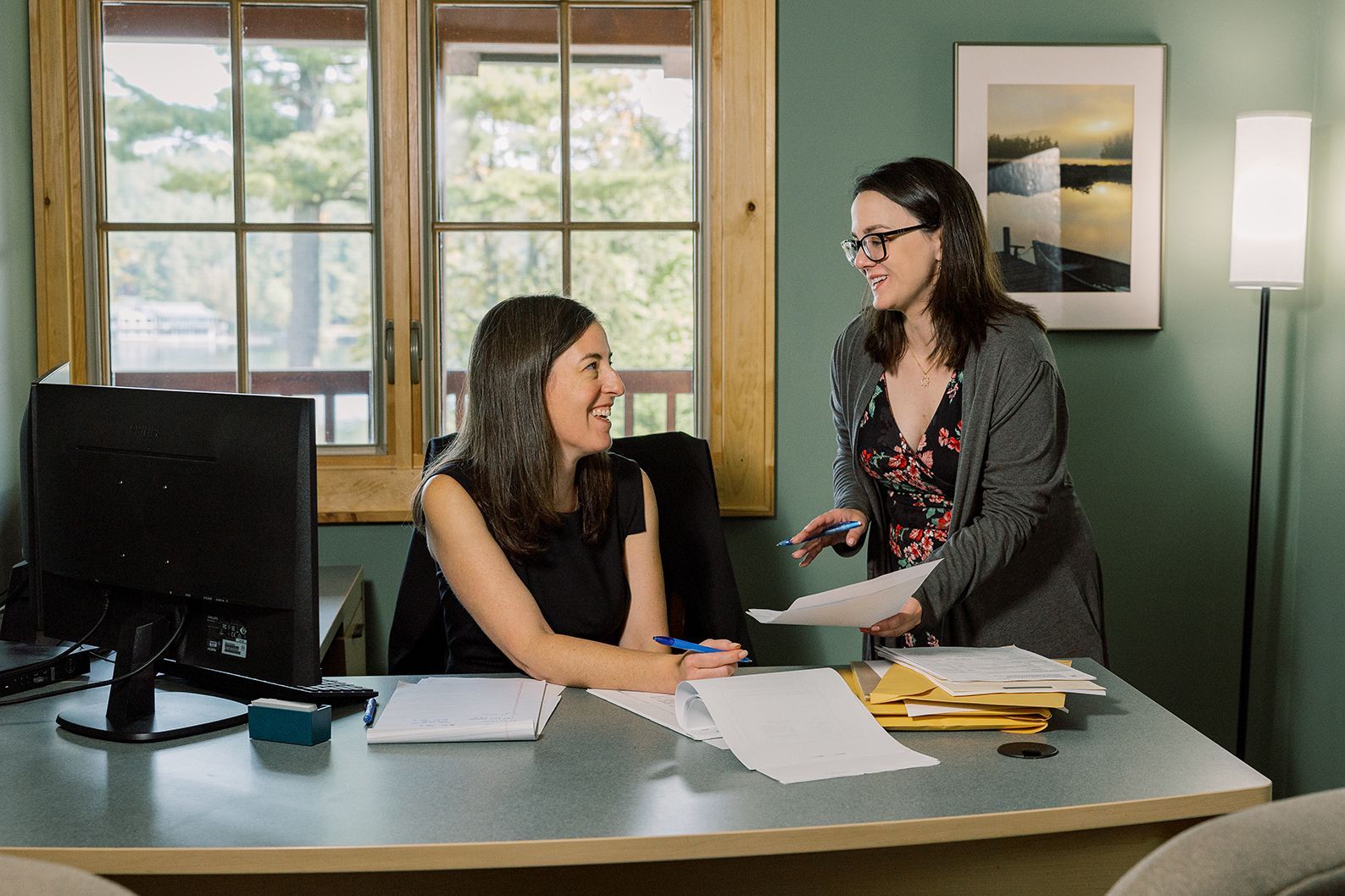 Attorney Molly Hann reviewing documents in the Tupper Lake NY Office.