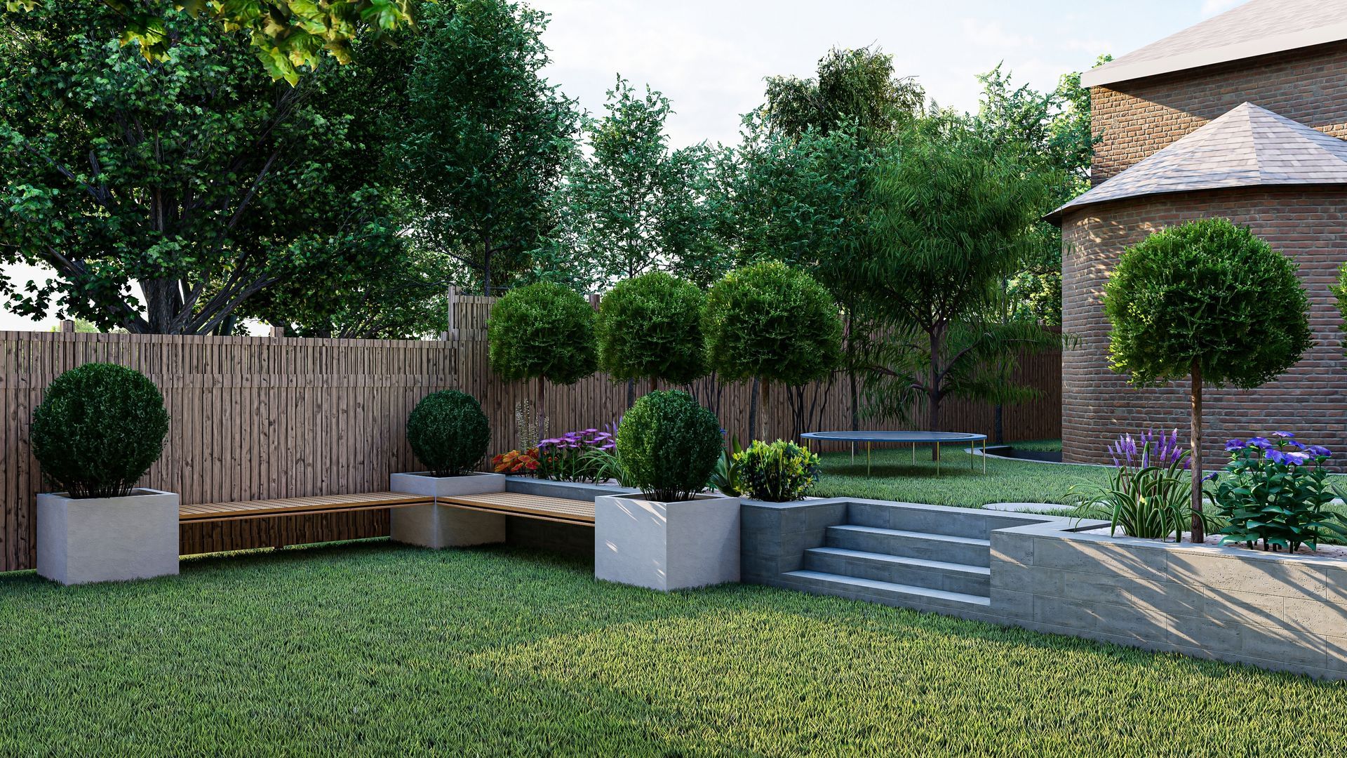 A landscaped backyard with grassy lawn, trees, planters, a bamboo fence, and a stone staircase.
