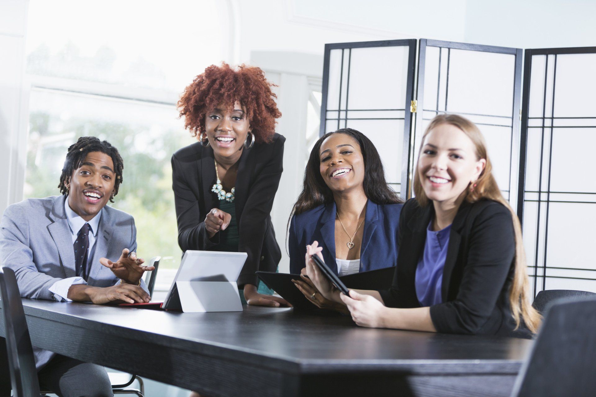 Two Business People Shaking Hands in An Office — Stony Point, NY — T & T Tax & Advisory Services