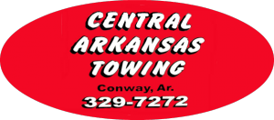 Red oval sign with white text: Central Arkansas Towing, Conway, Ar., 329-7272.