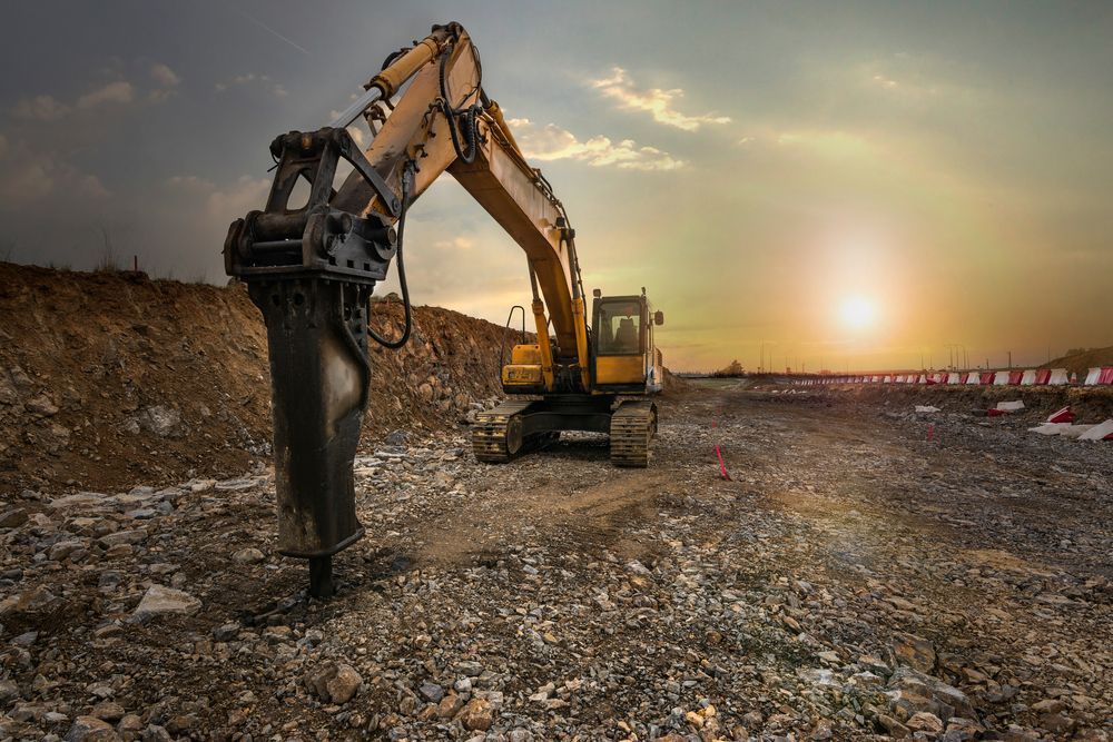 Yellow Excavator Creating a Road — AGM HIRE NQ in Kelso, QLD