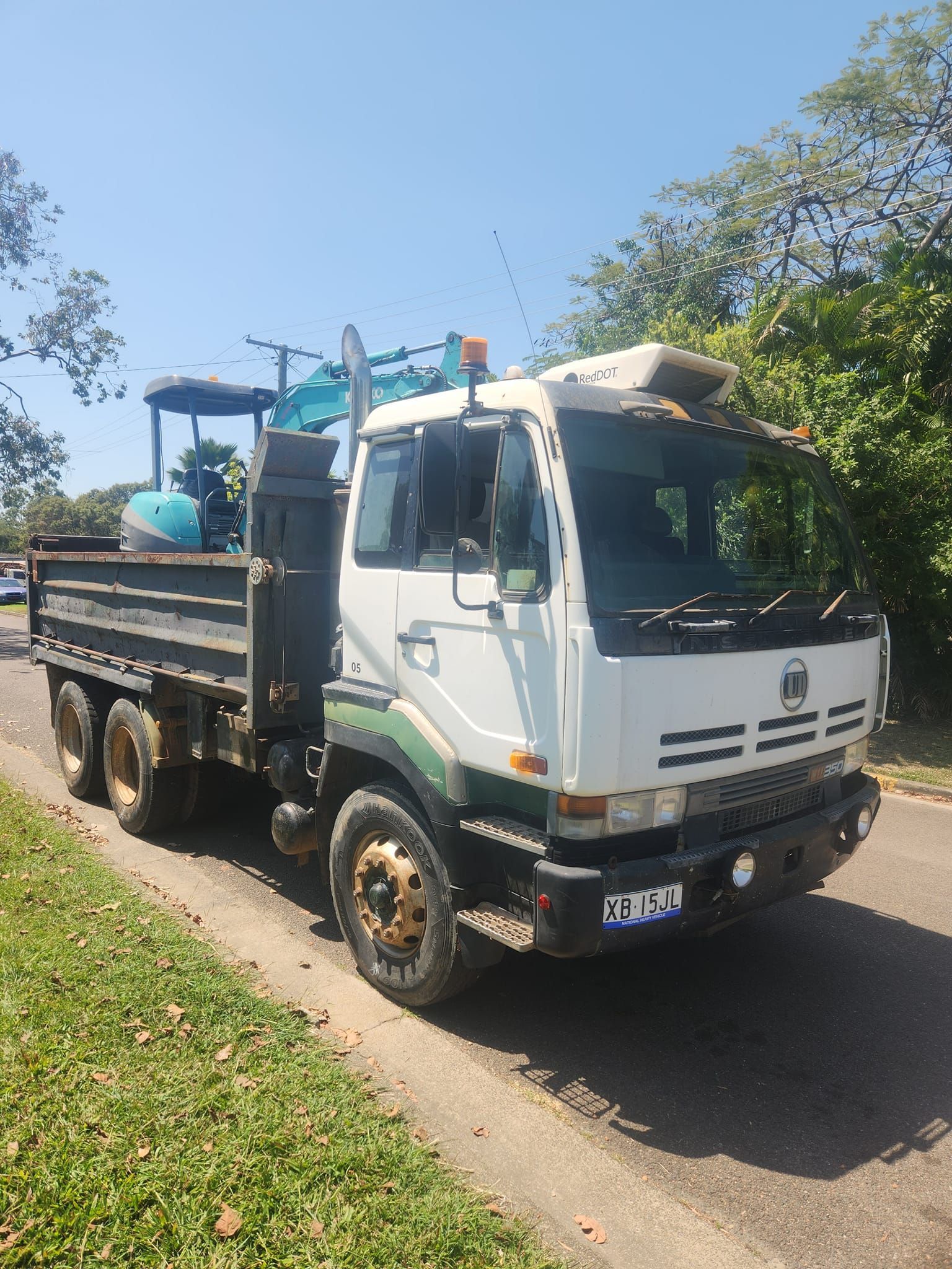 White and Green Dump Truck — AGM HIRE NQ in Kirwan, QLD