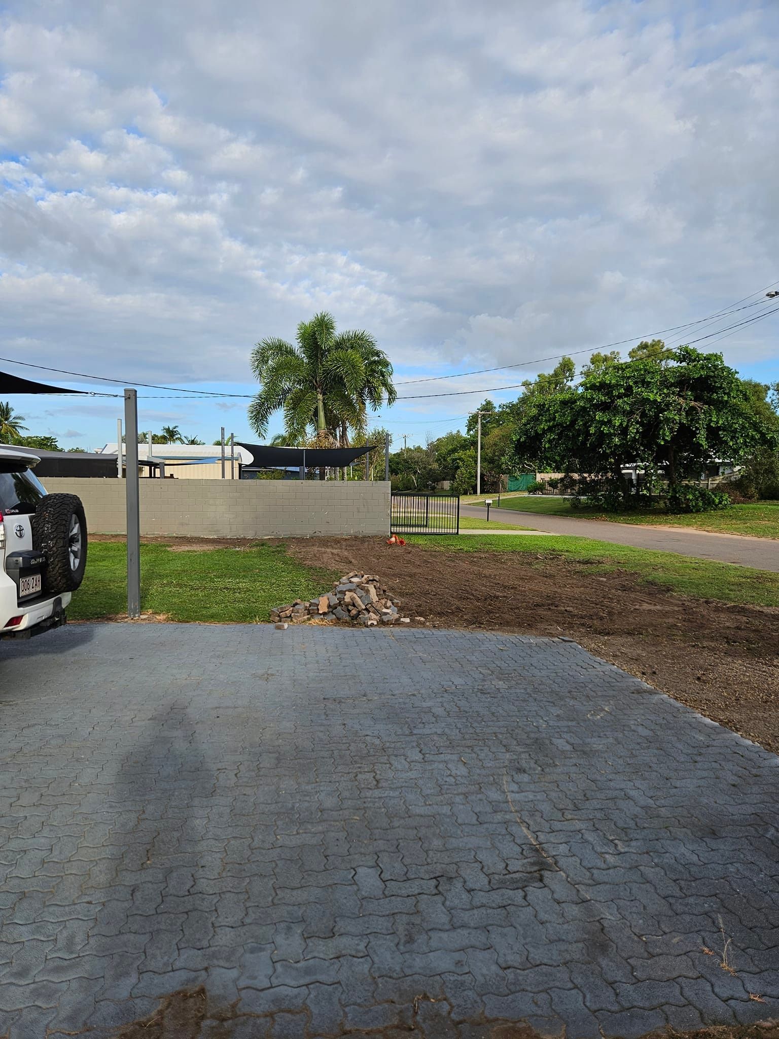 A Paved Driveway With a Vehicle Parked — AGM HIRE NQ in Kelso, QLD