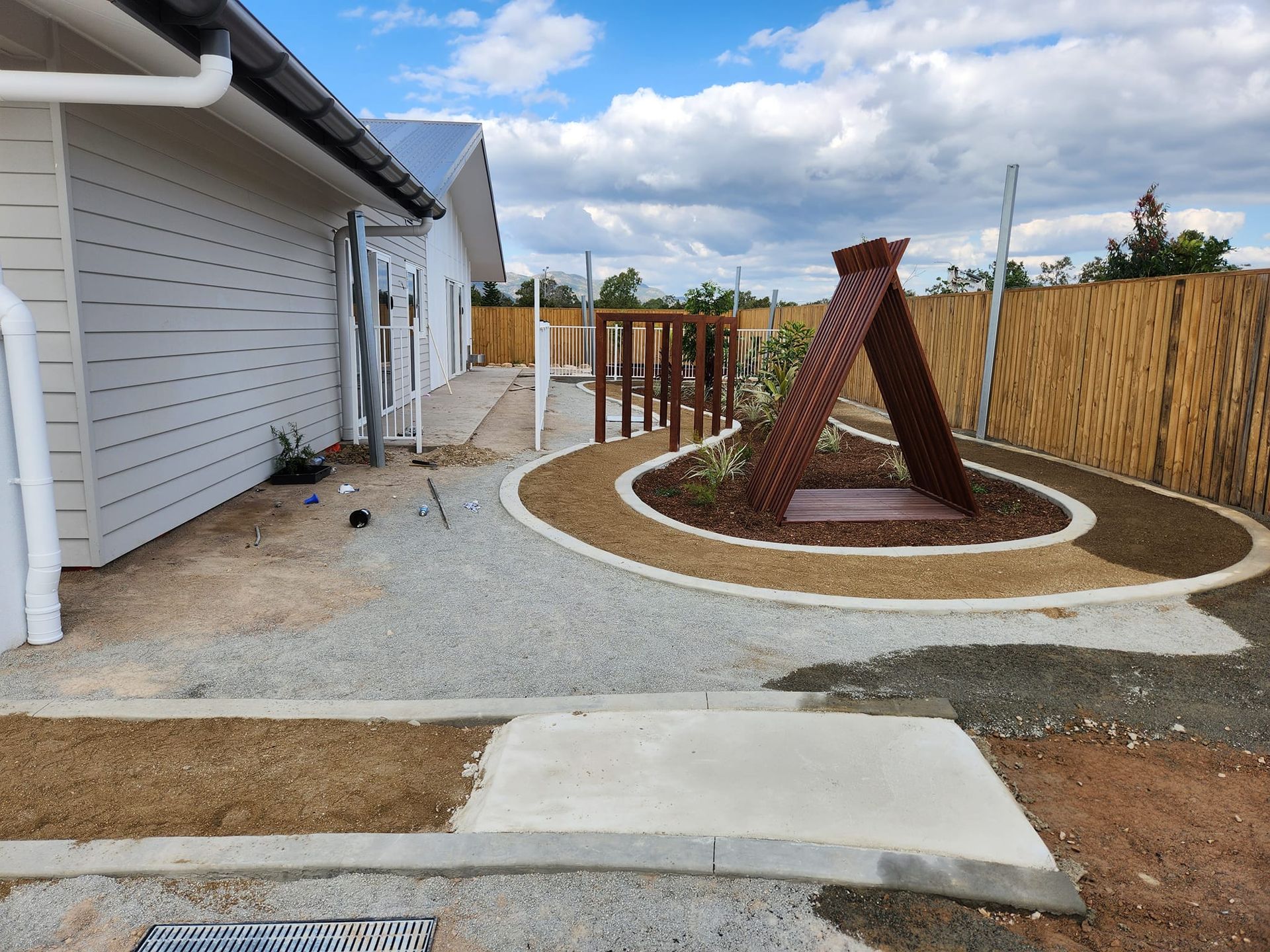 Exterior of a Building With a Gravel Path — AGM HIRE NQ in Condon, QLD