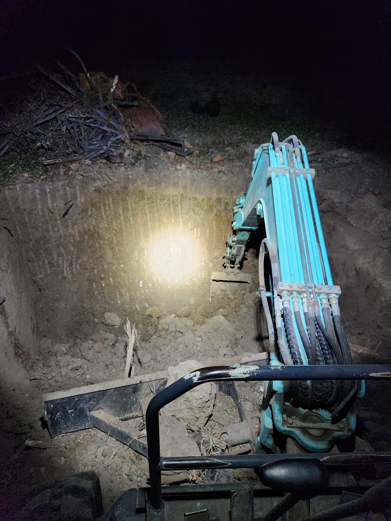 A Small, Teal Excavator Digging in a Dark — AGM HIRE NQ in Condon, QLD