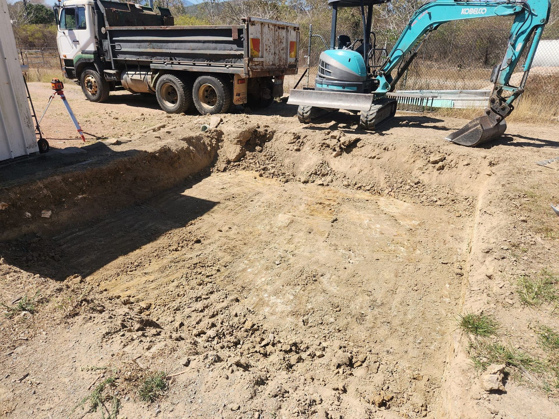 An Excavator Digging a Trench — AGM HIRE NQ in Condon, QLD