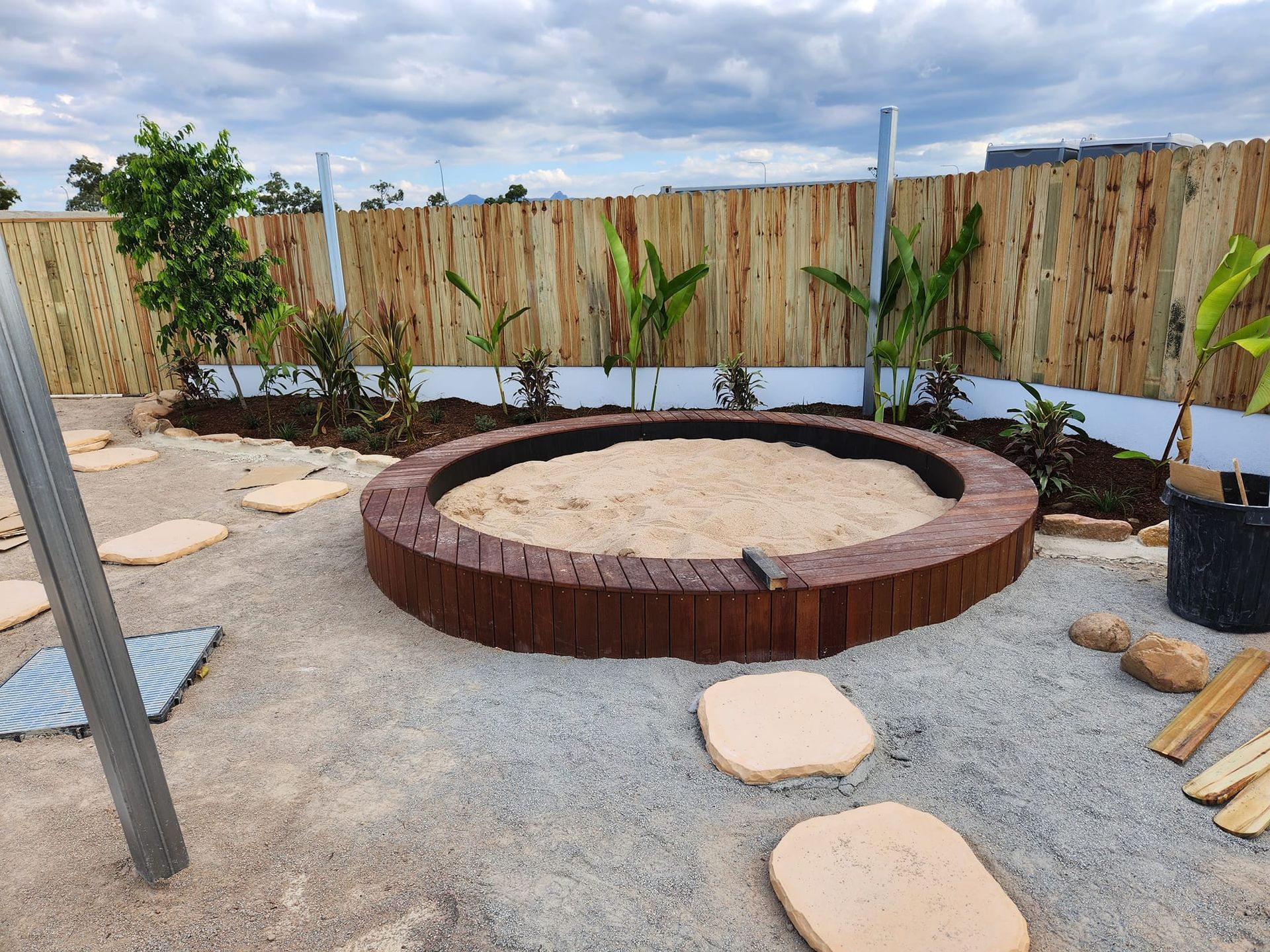 Round Sandbox With Wooden Border in a Gravel Play Area — AGM HIRE NQ in Condon, QLD